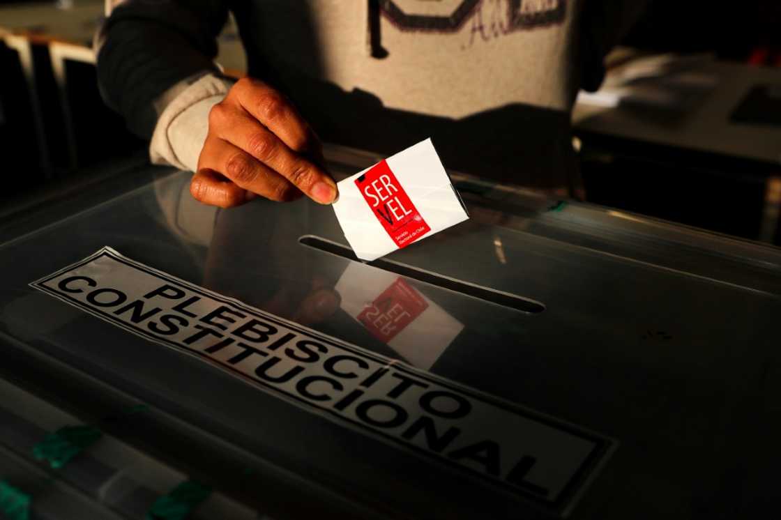 The new text was drawn up by a constitutional convention made up of 154 members -- mostly with no political affiliation -- split equally between men and women The new text was drawn up by a constitutional convention made up of 154 members -- mostly with no political affiliation -- split equally between men and women