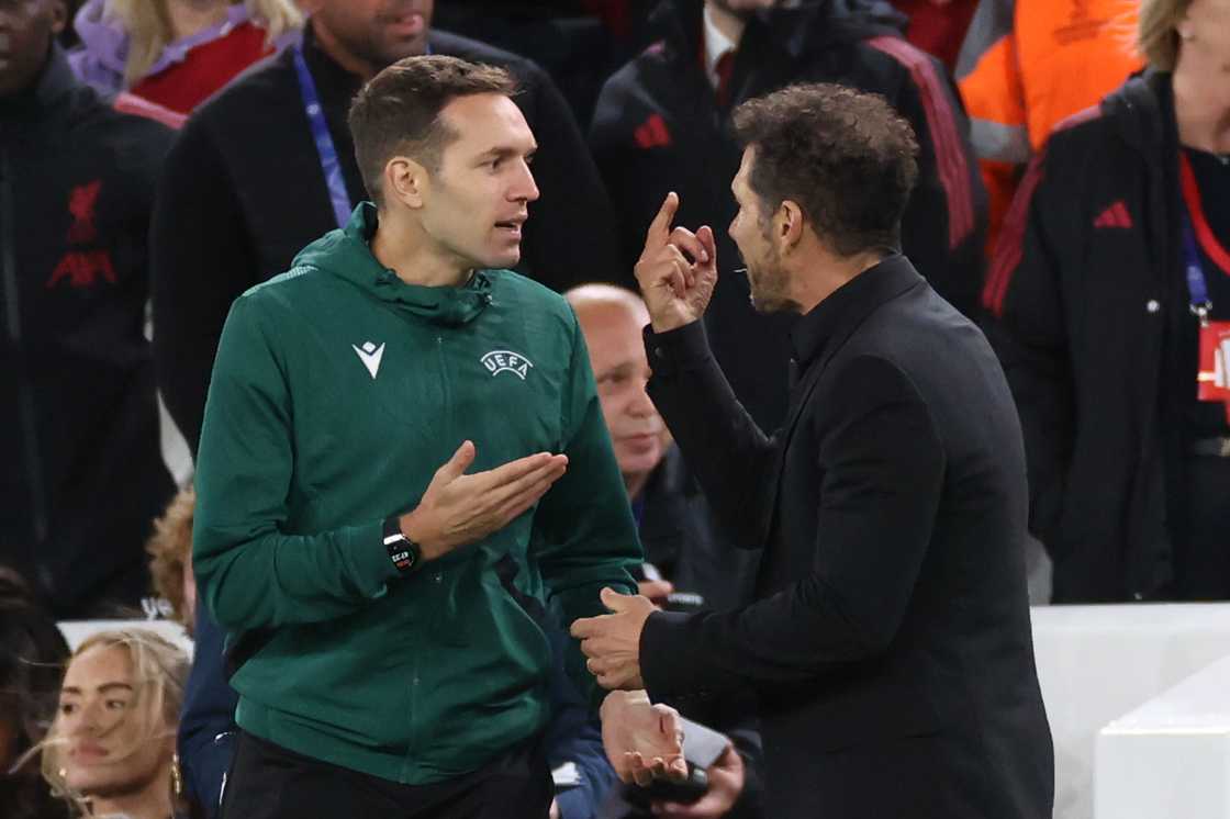 Diego Simeone Held Back by Security After Heated Moment With Liverpool Fans