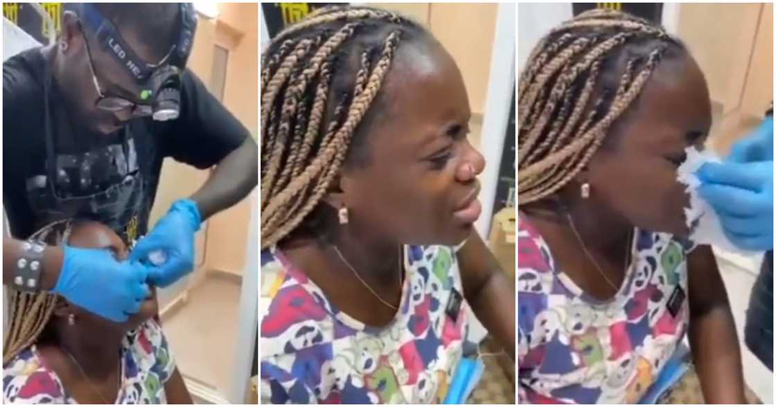 Lady weeps during piercing procedure