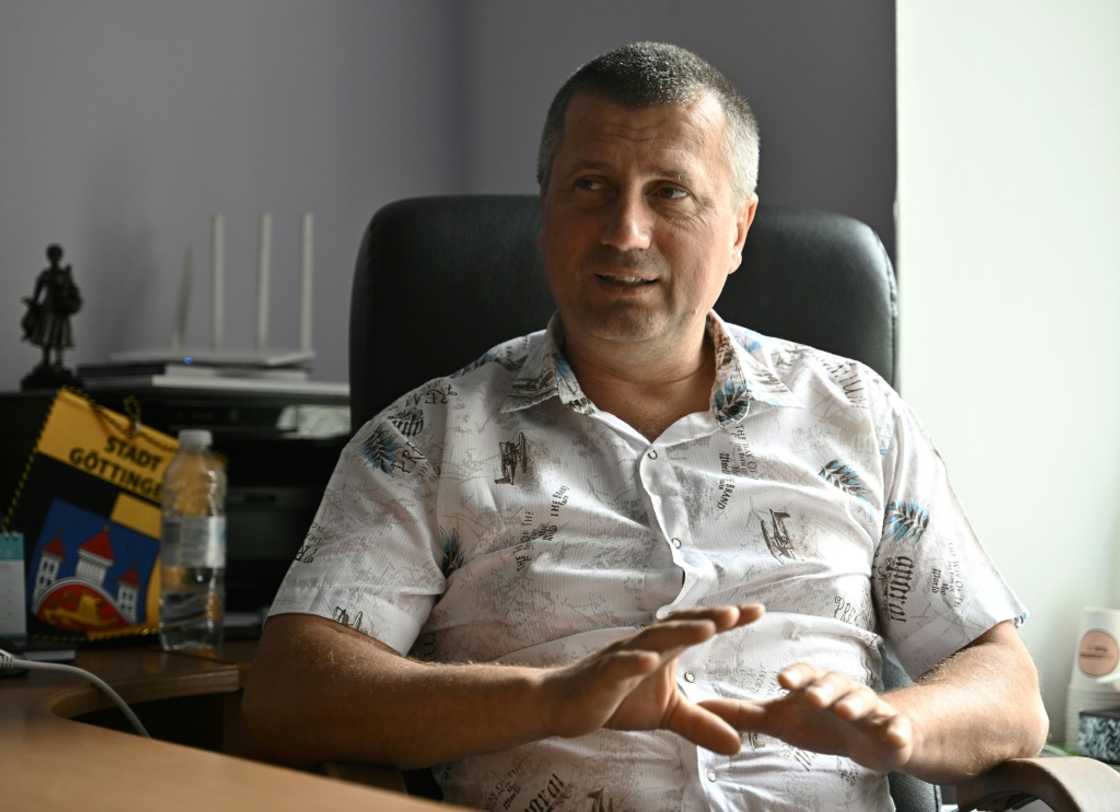 Okhtyrka's mayor Pavlo Kuzmenko says he managed to keep his citizens free and relatively safe by maintaining cool heads Okhtyrka's mayor Pavlo Kuzmenko says he managed to keep his citizens free and relatively safe by maintaining cool heads
