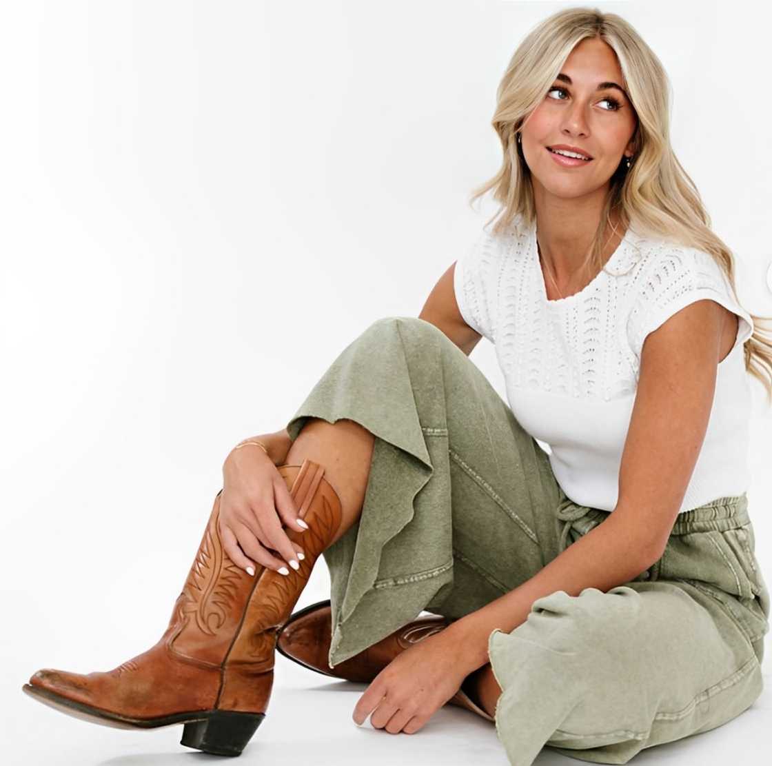 A woman wearing cowboy boots