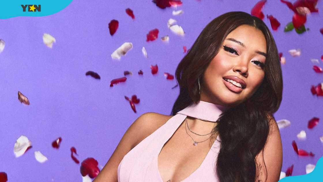 Denise Julia is posing in a light pink halter-neck mini-dress Denise Julia is posing in a light pink halter-neck mini-dress