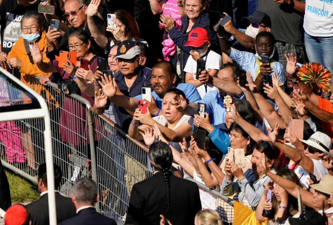 Catholic faithful take pictures and cheer as Pope Francis arrives at the shrine of Sainte-Anne-de-Beaupre in Quebec, Canada on July 28, 2022 Catholic faithful take pictures and cheer as Pope Francis arrives at the shrine of Sainte-Anne-de-Beaupre in Quebec, Canada on July 28, 2022