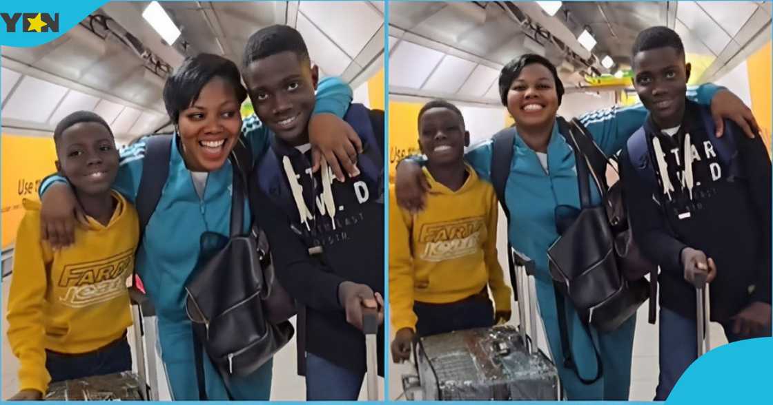 Photo of a Ghanaian woman posing for pictures with two boys at the Heathrow airport.