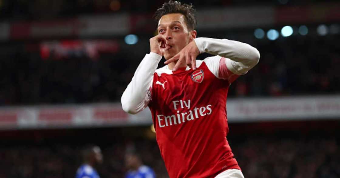 Mesut Ozil of Arsenal celebrates after he scores his sides first goal during the Premier League match between Arsenal FC and Leicester City at Emirates Stadium on October 22, 2018 in London, United Kingdom. (Photo by Clive Rose/Getty Images)