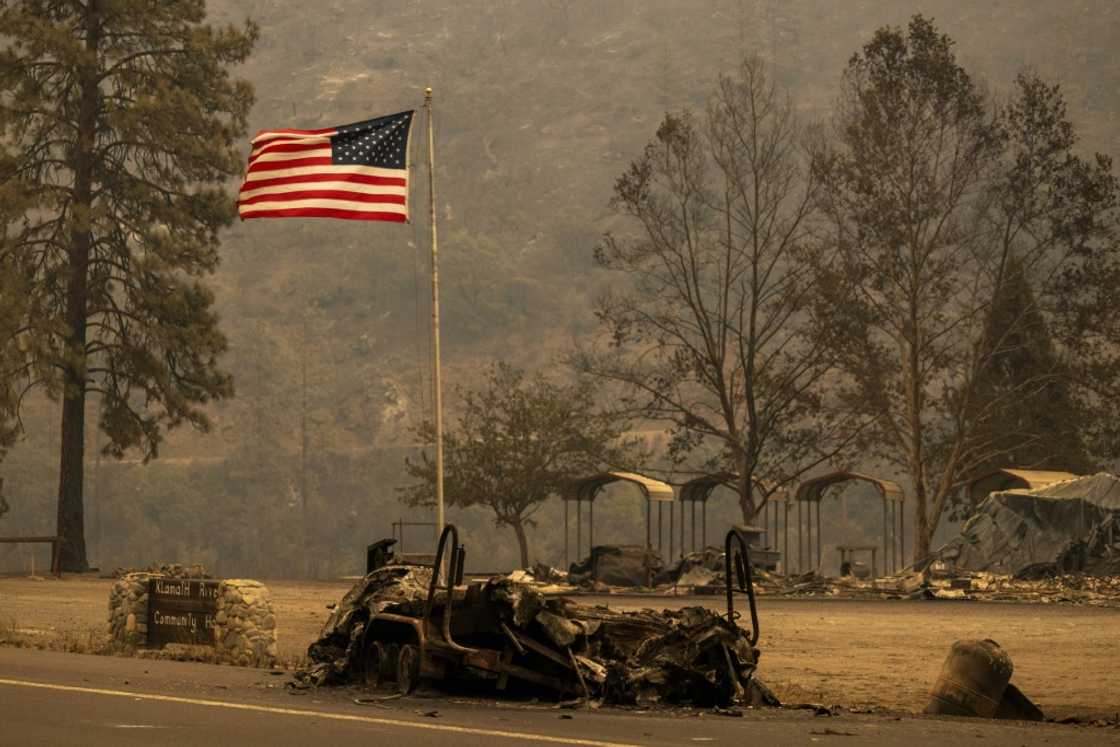 The charred remains of a boat on a trailer northwest of Yreka, California The charred remains of a boat on a trailer northwest of Yreka, California