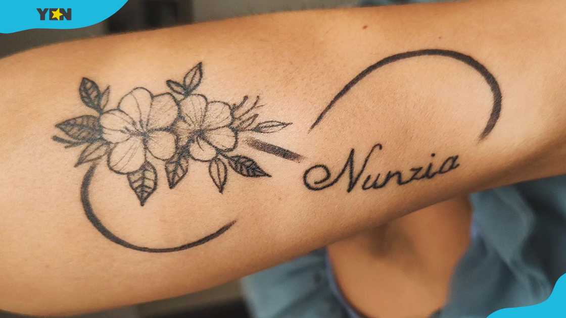 Floral infinity name tattoo