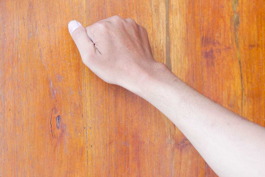 A man is knocking at the door A man is knocking at the door