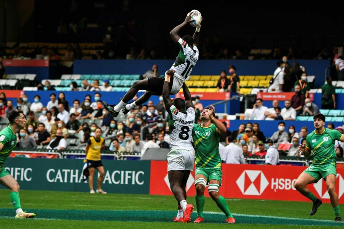 Kenya's Johnstone Olindi (top) is lifted by teammate Herman Humwa (C) against Ireland in the Hong Kong Sevens rugby tournament on November 4, 2022. Kenya's Johnstone Olindi (top) is lifted by teammate Herman Humwa (C) against Ireland in the Hong Kong Sevens rugby tournament on November 4, 2022.