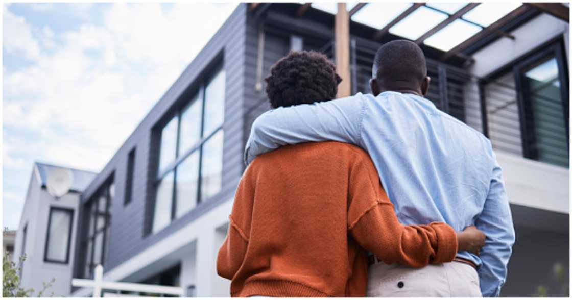 A couple considers a property they want to buy