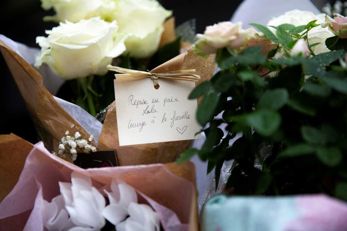 Locals left flowers with a hand-written message which read 'Rest in peace Lola, courage for the family', outside the building where the 12-year-old disappeared Locals left flowers with a hand-written message which read 'Rest in peace Lola, courage for the family', outside the building where the 12-year-old disappeared