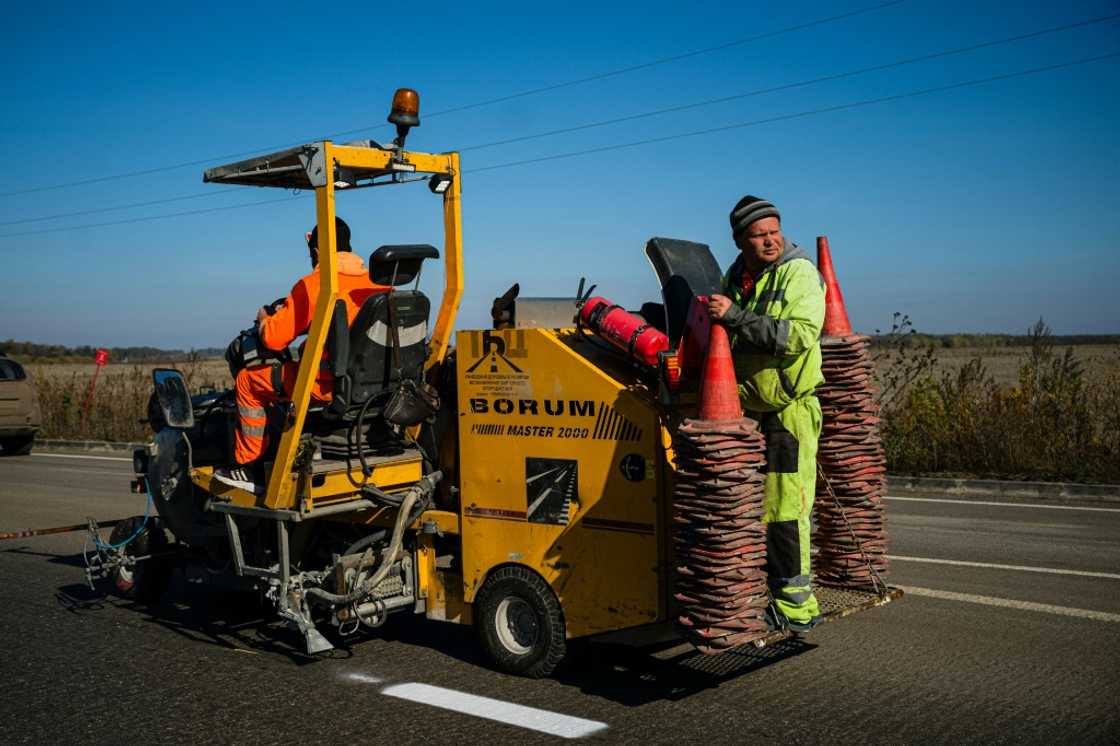 Teams have been repairing roads near Izyum weeks after the liberation of the small town in eastern Ukraine