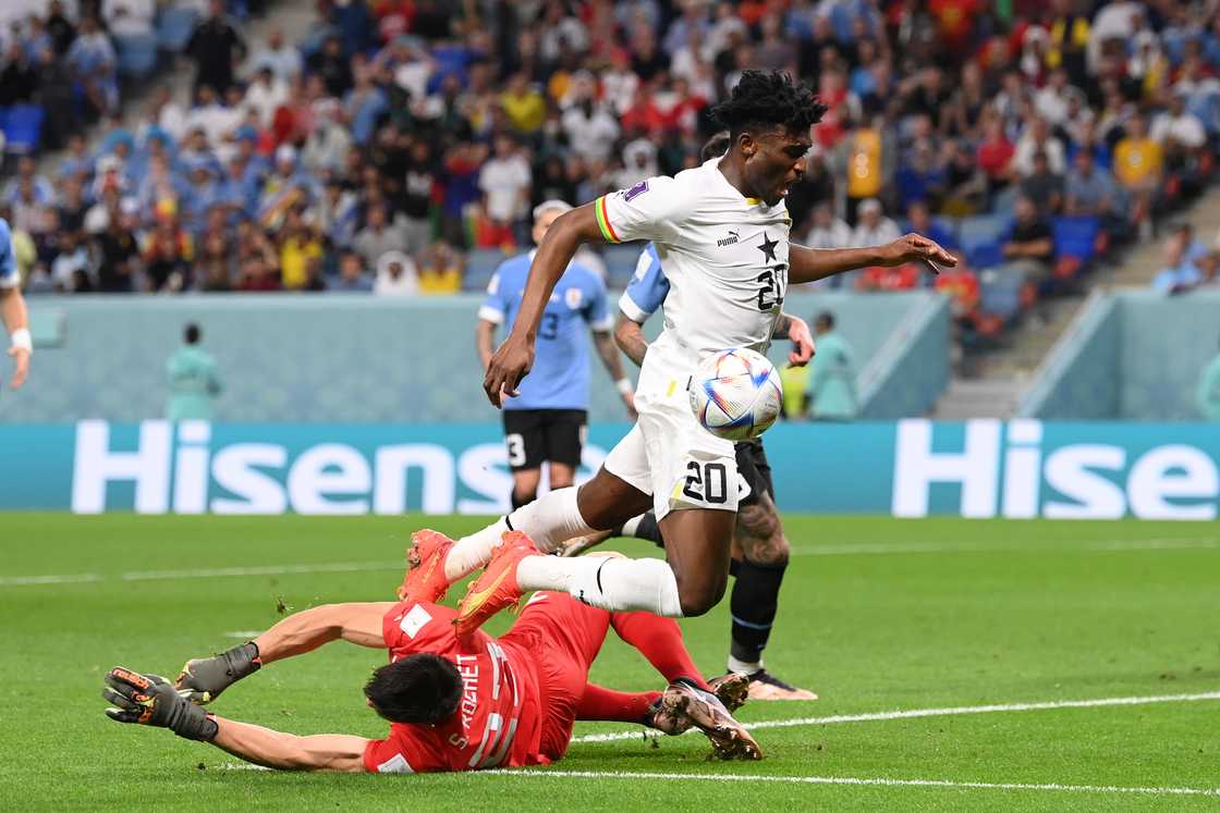 Mohammed Kudus of Ghana is brought down by Sergio Rochet of Uruguay in the box during the FIFA World Cup Qatar 2022 Group H match between Ghana and Uruguay at Al Janoub Stadium on December 02, 2022 in Al Wakrah, Qatar Mohammed Kudus of Ghana is brought down by Sergio Rochet of Uruguay in the box during the FIFA World Cup Qatar 2022 Group H match between Ghana and Uruguay at Al Janoub Stadium on December 02, 2022 in Al Wakrah, Qatar