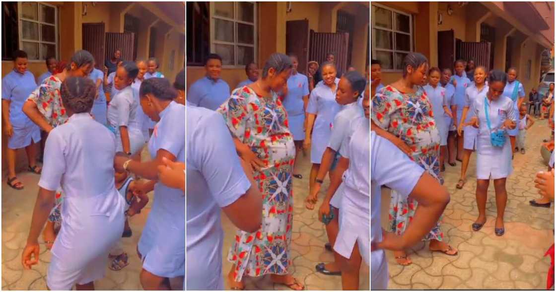 Over 15 nurses happily dance with pregnant lady in hospital compound Over 15 nurses happily dance with pregnant lady in hospital compound