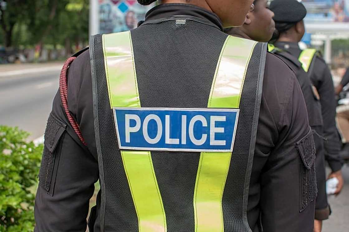police officer, mttd, rainfall, rain fall, heavy rain, abeka junction, ghana, traffic, two police officers at Abeka Junction