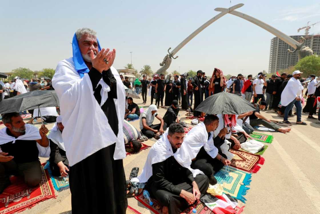 Supporters of Iraqi cleric Moqtada Sadr gather for prayers at the Green Zone in Baghdad, where they occupy the parliament Supporters of Iraqi cleric Moqtada Sadr gather for prayers at the Green Zone in Baghdad, where they occupy the parliament