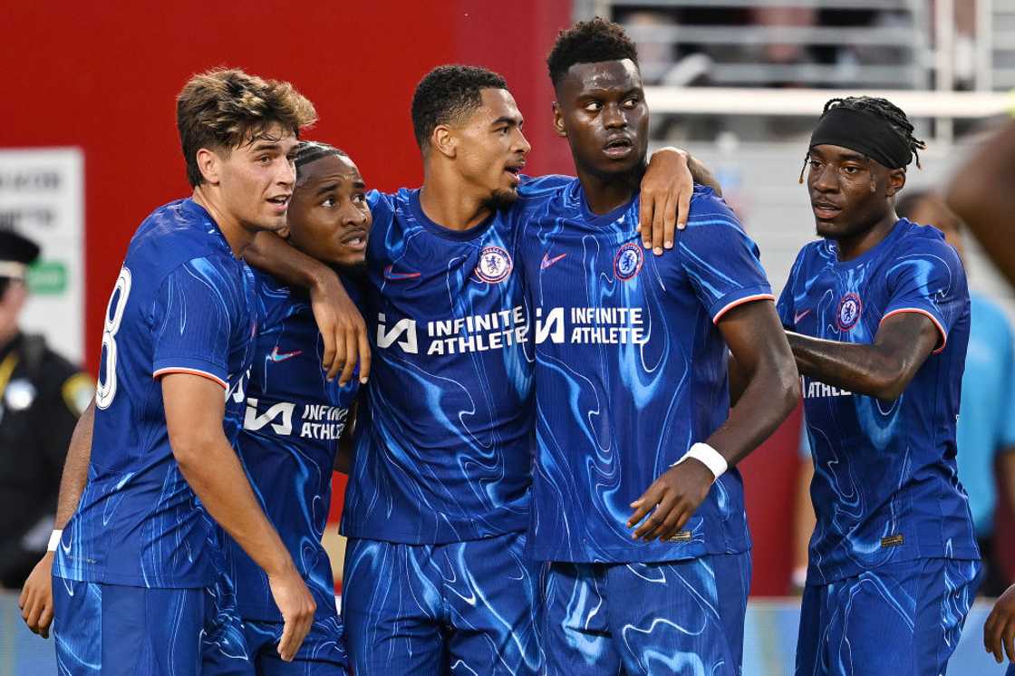 Cristopher Nkunku celebrates with his Chelsea teammates. Cristopher Nkunku celebrates with his Chelsea teammates.