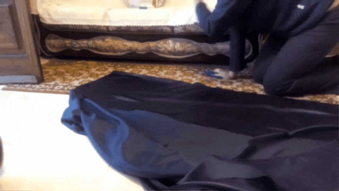 A woman cutting out the fabric for a circle skirt