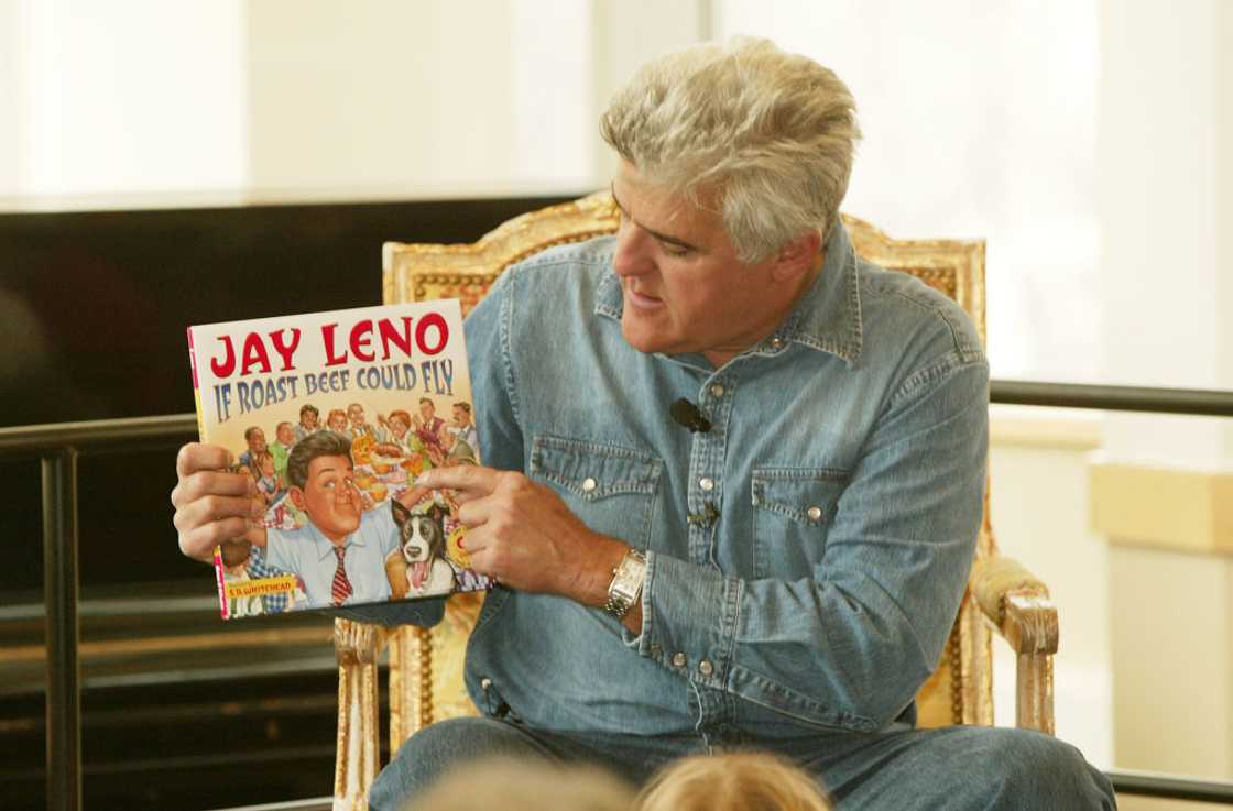Jay Leno holding 1 his books Jay Leno holding 1 his books