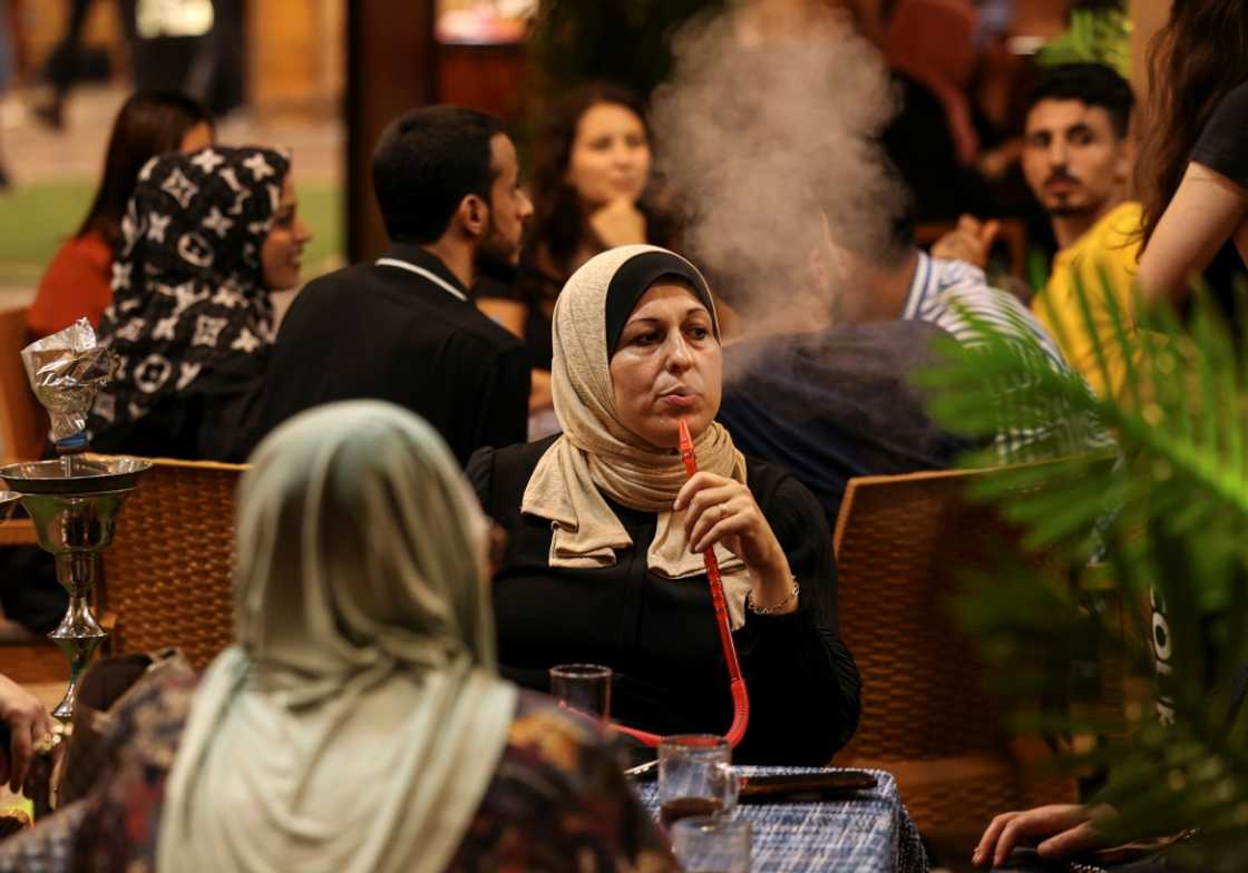 Palestinian women sit at a beach coffee shop in Gaza: but with unemployment rates hitting 47 percent last year, such outings are an unaffordable luxury for many