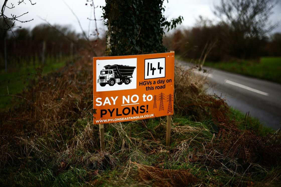 A sign on the side of a UK road protesting against the construction of a new National Grid electricity pylon route A sign on the side of a UK road protesting against the construction of a new National Grid electricity pylon route