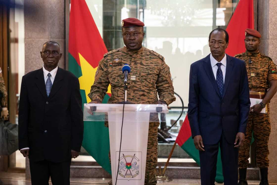 Burkina Faso junta leader Lieutenant-Colonel Paul-Henri Sandaogo Damiba (C) has taken over the role of defence minister as well Burkina Faso junta leader Lieutenant-Colonel Paul-Henri Sandaogo Damiba (C) has taken over the role of defence minister as well