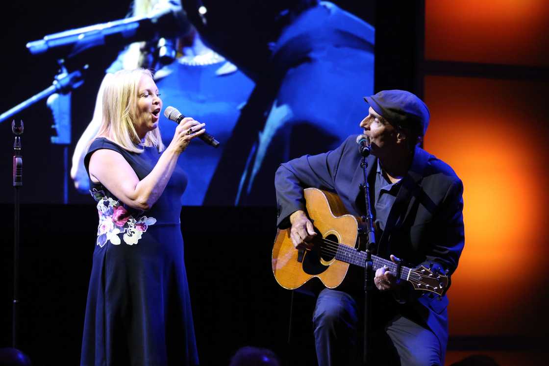 Kim Taylor and James Taylor perform onstage at the USC Shoah Foundation Ambassadors for Humanity Gala honouring William Clay Ford, Jr. Kim Taylor and James Taylor perform onstage at the USC Shoah Foundation Ambassadors for Humanity Gala honouring William Clay Ford, Jr.