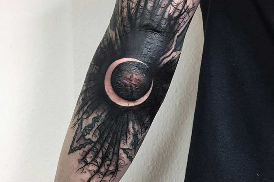 A striking moon elbow tattoo A striking moon elbow tattoo