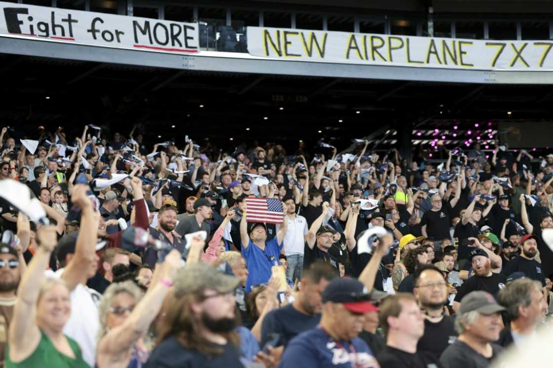 Members and supporters of the International Association of Machinists and Aerospace Worker Union (IAM) District 751 cheer during an early strike-sanction vote event at T-Mobile Park in Seattle, Washington on July 17, 2024