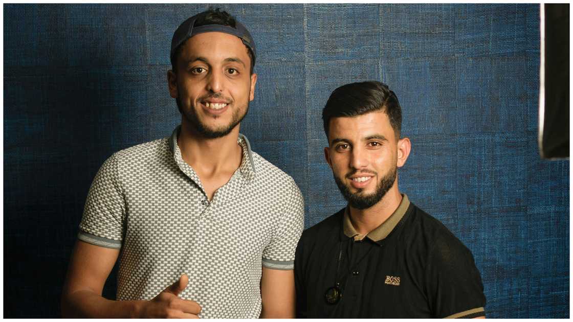 Two men in polo shirts Two men in polo shirts