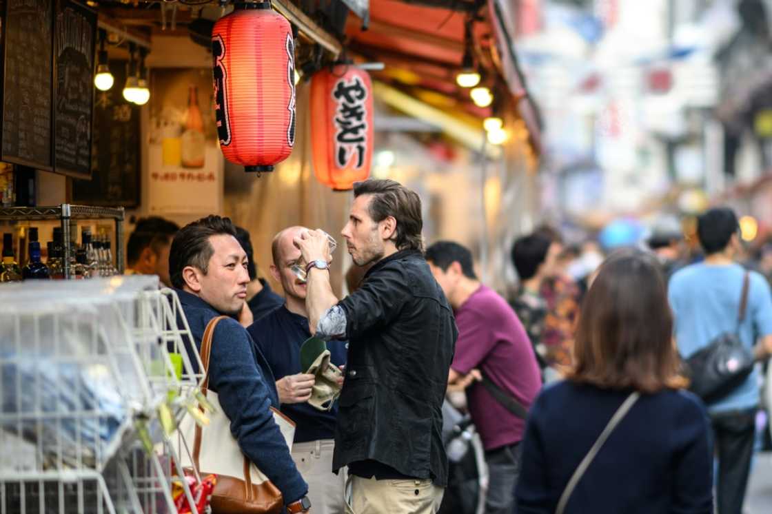 Many tourists are taking advantage of the weak yen to splurge out on shopping and dining Many tourists are taking advantage of the weak yen to splurge out on shopping and dining