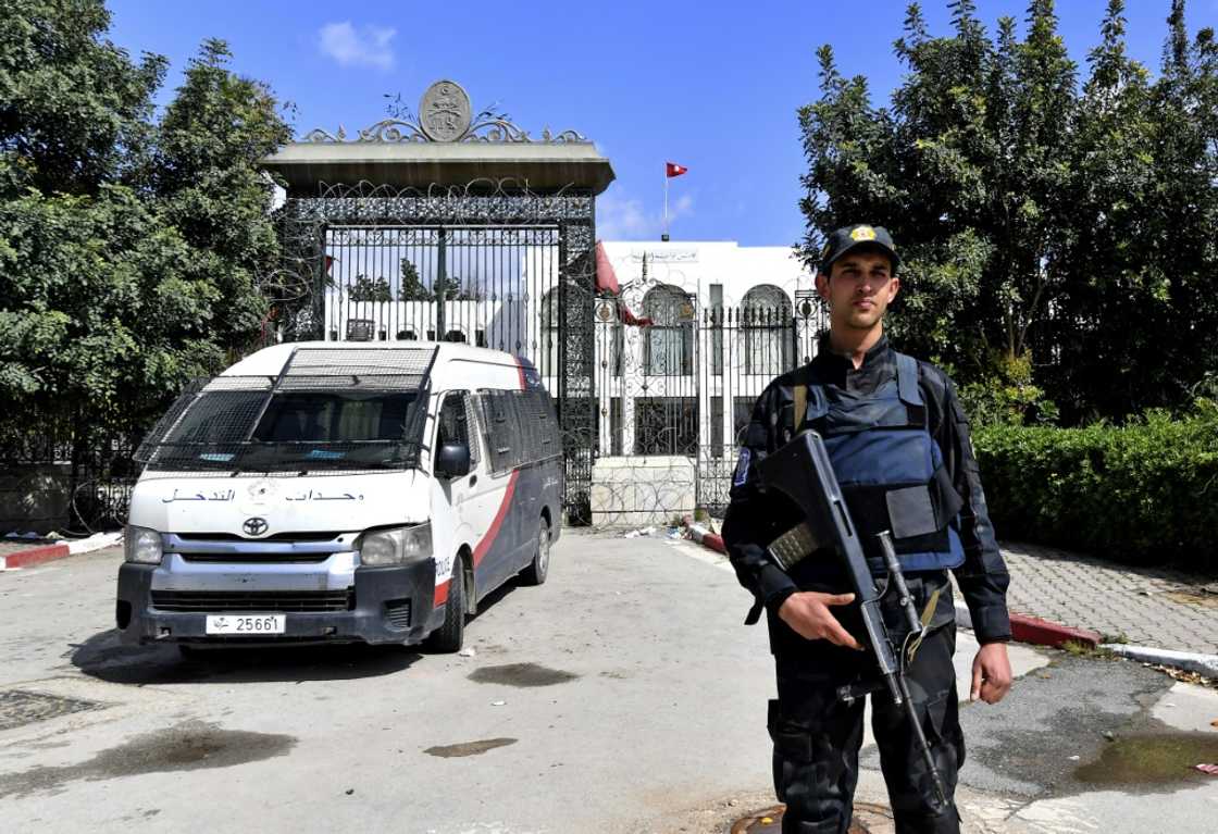 A Tunisian security guard stands guard outside parliament in Tunis on March 31, 2022 A Tunisian security guard stands guard outside parliament in Tunis on March 31, 2022