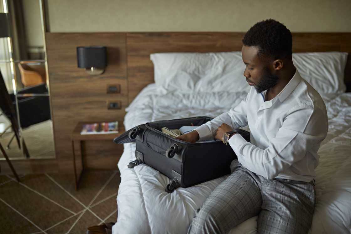 A man packing his bag A man packing his bag