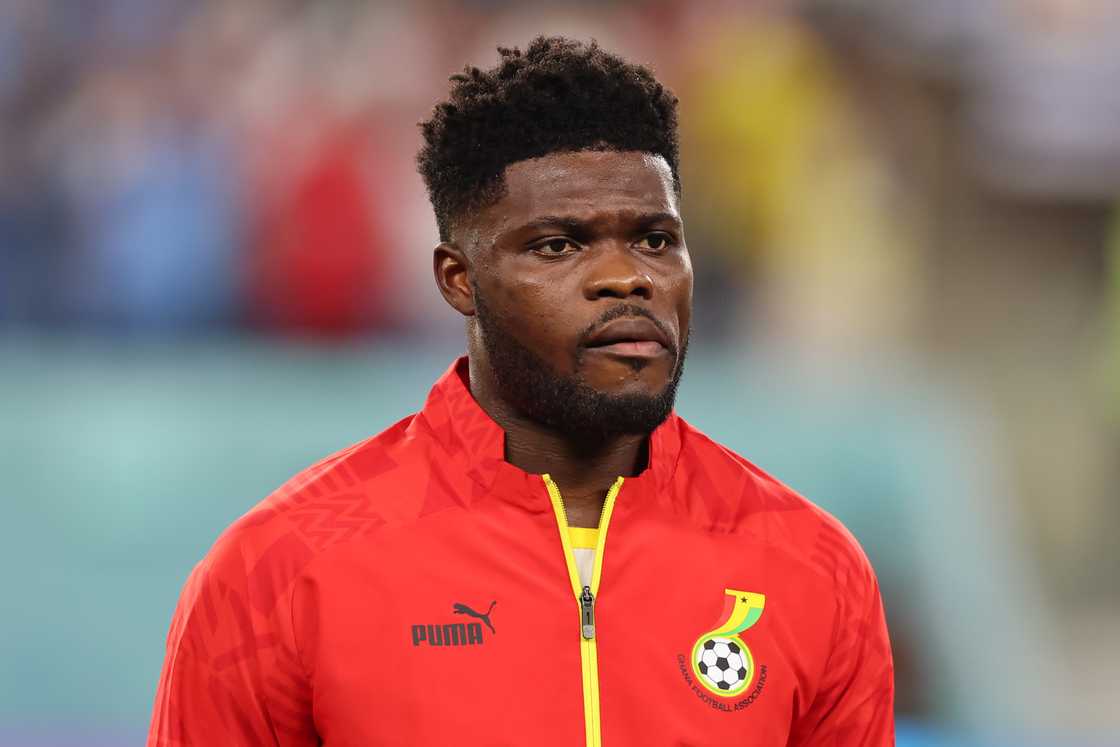 Thomas Partey of Ghana reacts during the line up for the National anthems prior to kick off in the FIFA World Cup Qatar 2022 Group H match between Ghana and Uruguay at Al Janoub Stadium on December 02, 2022 in Al Wakrah, Qatar Thomas Partey of Ghana reacts during the line up for the National anthems prior to kick off in the FIFA World Cup Qatar 2022 Group H match between Ghana and Uruguay at Al Janoub Stadium on December 02, 2022 in Al Wakrah, Qatar