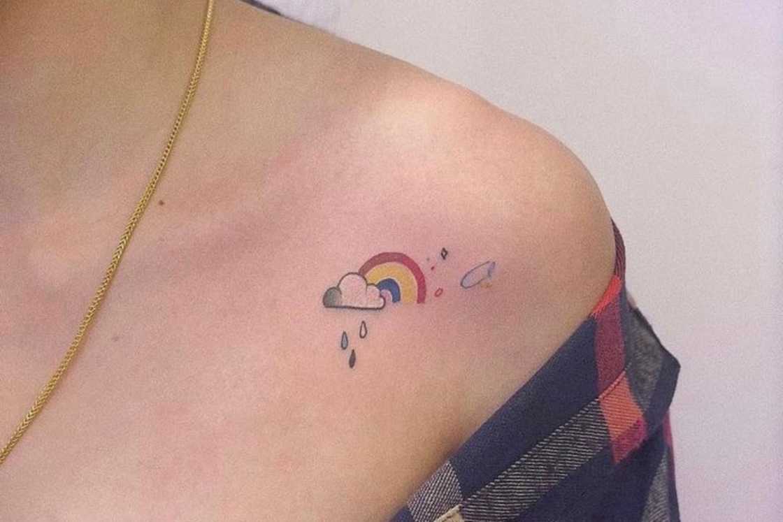 Tiny rainbow on a rainy day shoulder tattoo Tiny rainbow on a rainy day shoulder tattoo
