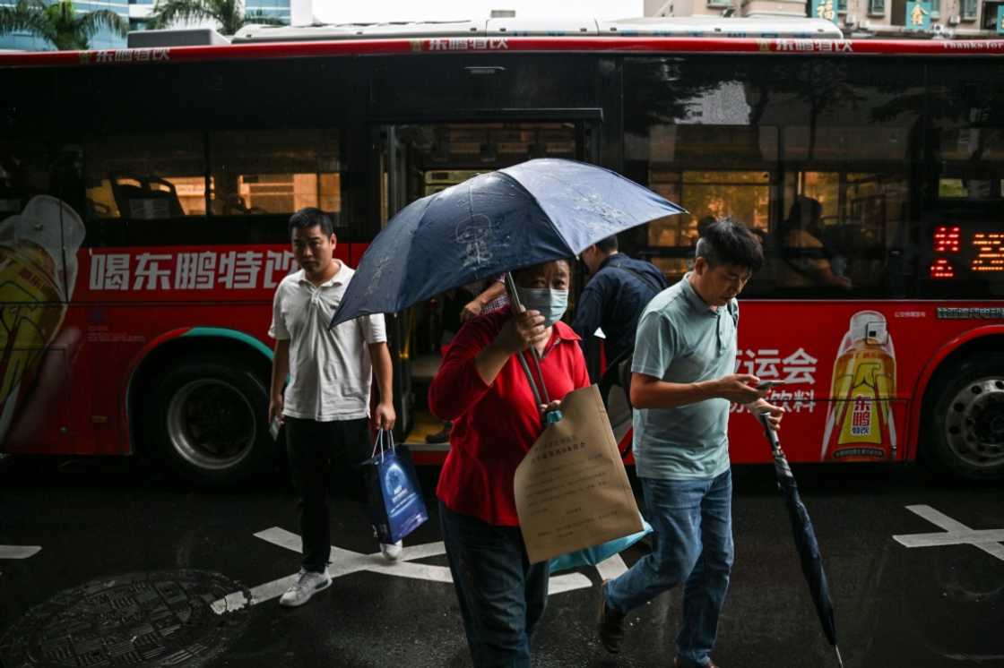 On a rainy afternoon in Shenzhen, damp passengers jostle their way onto the megacity's buses, the quiet foot soldiers of an electric revolution On a rainy afternoon in Shenzhen, damp passengers jostle their way onto the megacity's buses, the quiet foot soldiers of an electric revolution