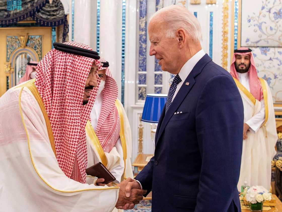 This handout aerial image released by the Saudi press Agency (SPA) shows (L to R) Saudi Arabia's King Salman receiving US President Joe Biden as Crown Prince Mohammed bin Salman looks on behind This handout aerial image released by the Saudi press Agency (SPA) shows (L to R) Saudi Arabia's King Salman receiving US President Joe Biden as Crown Prince Mohammed bin Salman looks on behind