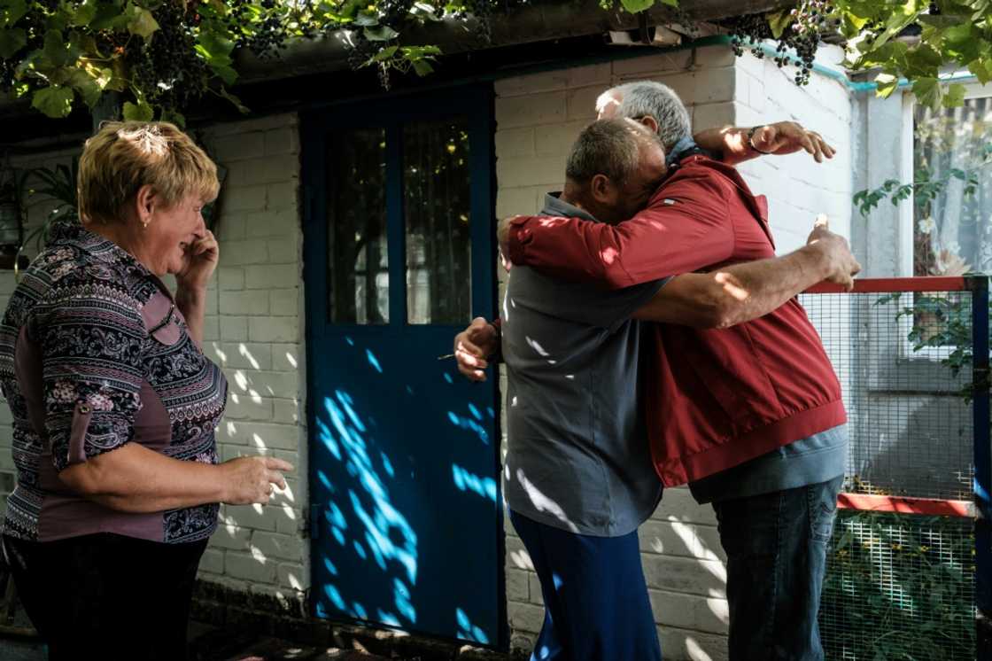Residents of the village of Troitske in east Ukraine reunite after the town's recapture by Kyiv's forces and a months-long occupation by Russia's army Residents of the village of Troitske in east Ukraine reunite after the town's recapture by Kyiv's forces and a months-long occupation by Russia's army