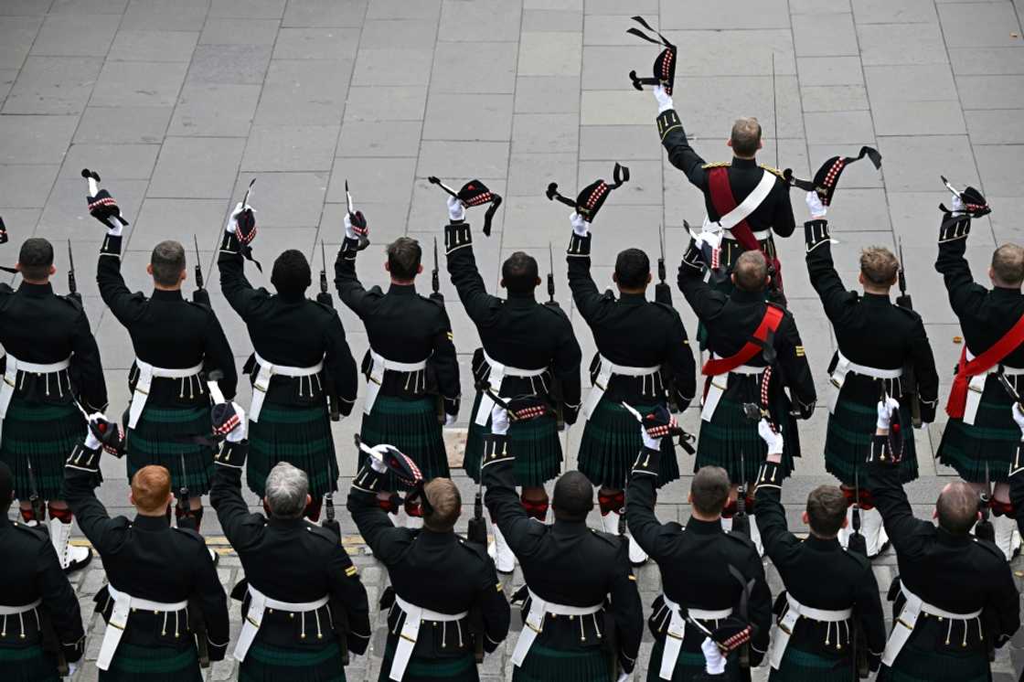 Members of the Royal Regiment of Scotland outside St Giles' Cathedral in Edinburgh Members of the Royal Regiment of Scotland outside St Giles' Cathedral in Edinburgh