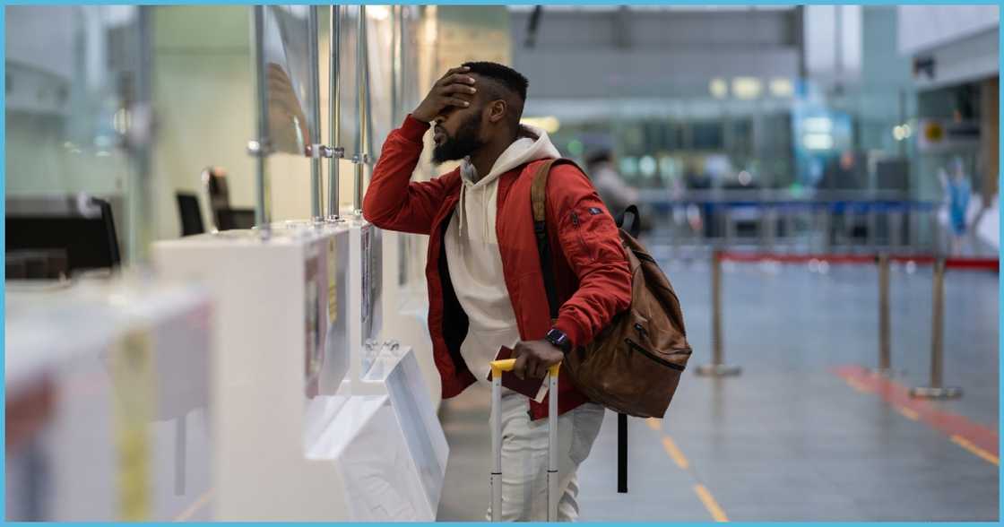 A man abroad looking disappointed A man abroad looking disappointed