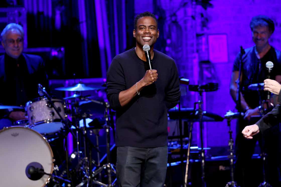 Chris Rock performs onstage during the Night of Too Many Stars Chris Rock performs onstage during the Night of Too Many Stars
