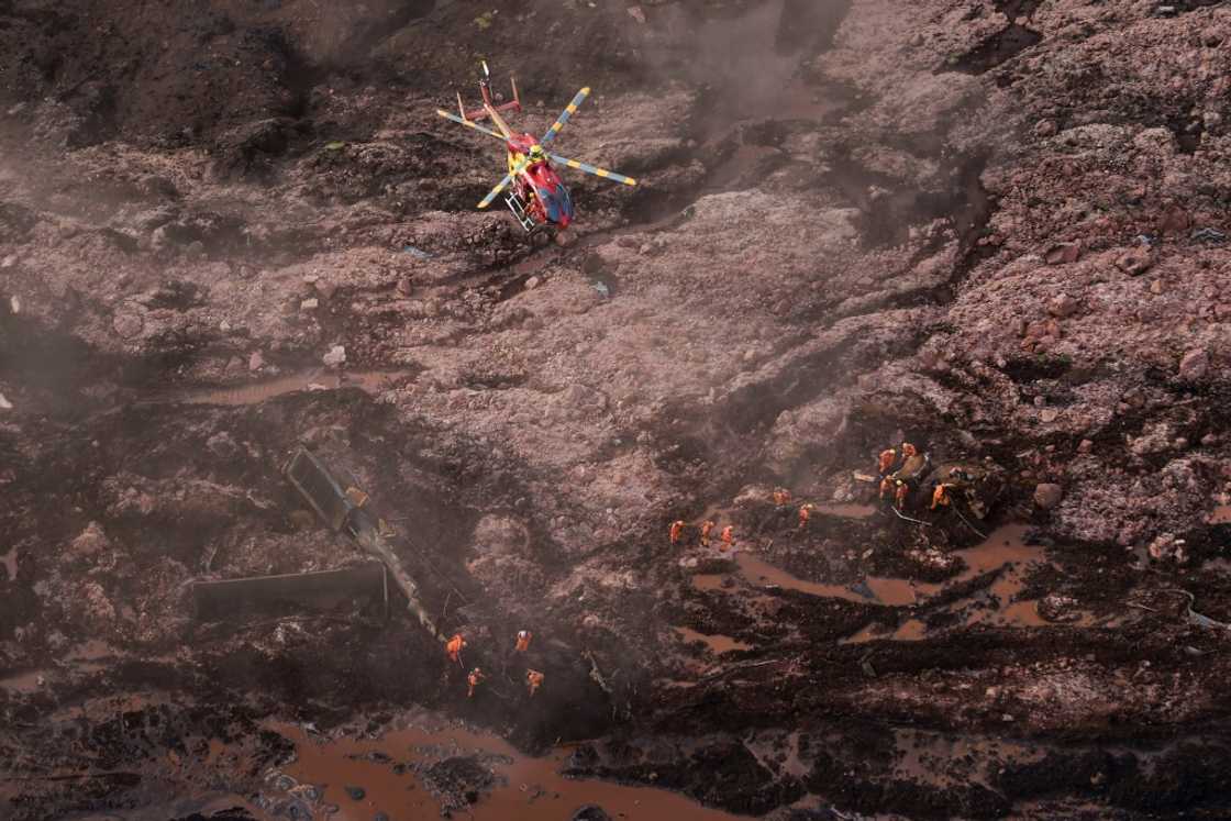 Rescue workers searching for victims after the spill Rescue workers searching for victims after the spill