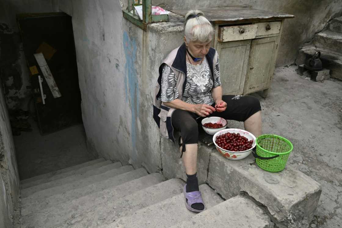 Three months stuck in a cellar: Lyudmila pits cherries outside her basement in Siversk as Russian forces draw closer Three months stuck in a cellar: Lyudmila pits cherries outside her basement in Siversk as Russian forces draw closer