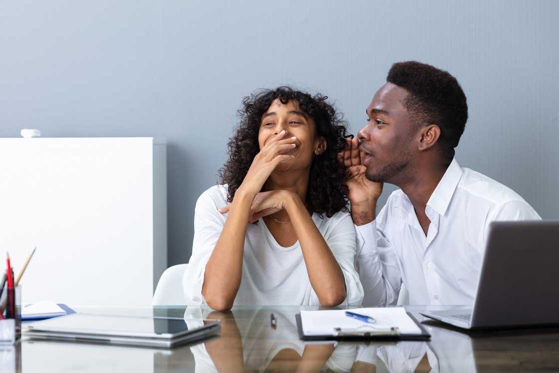 Employees are gossiping in the office Employees are gossiping in the office