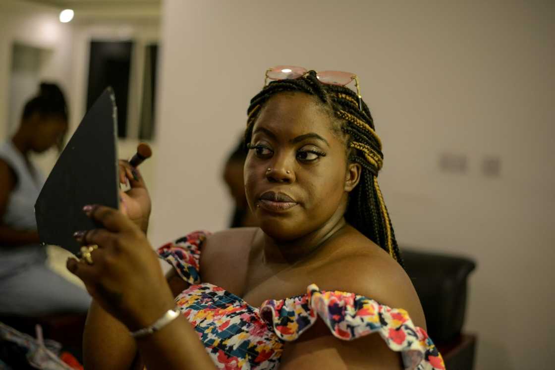 A model prepares for the East African Plus Size Fashion Affair A model prepares for the East African Plus Size Fashion Affair