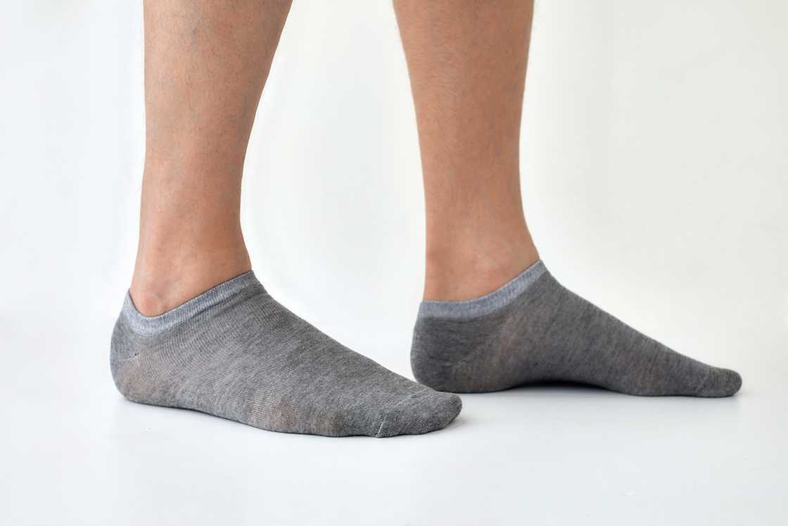 A person with grey ankle socks A person with grey ankle socks