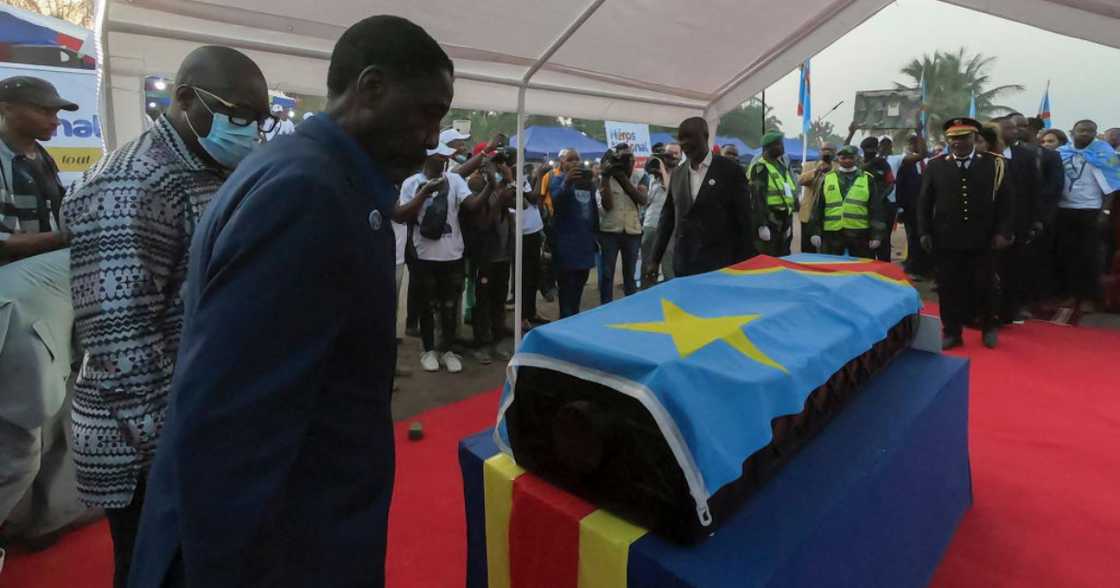 Patrice Lumumba's son pays his last respect to his coffin.