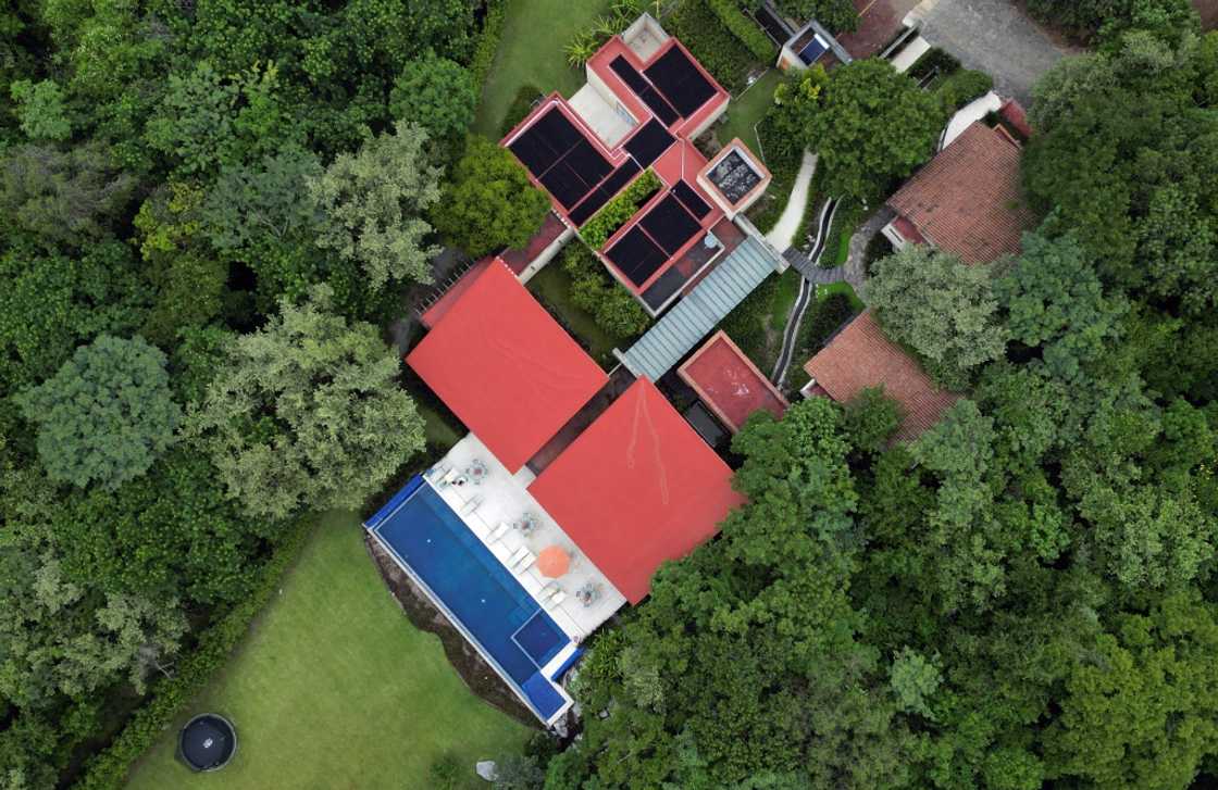 The elderly have built houses on a plot of land surrounded by forests and mountains in central Mexico