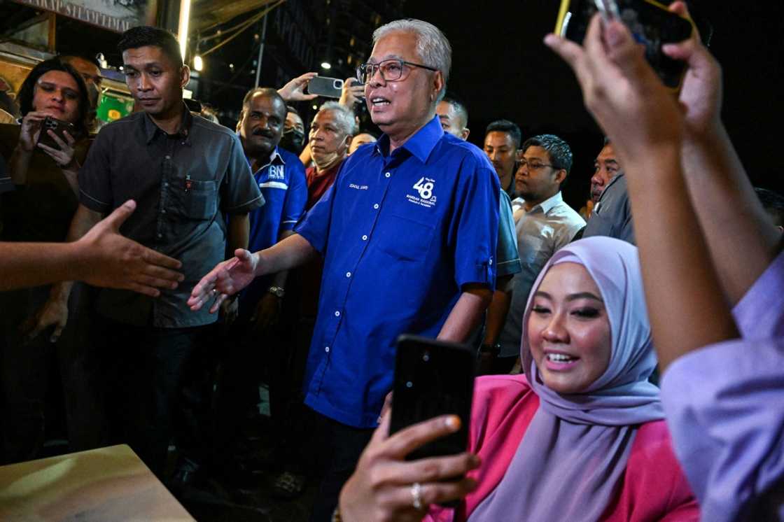 Caretaker Prime Minister Ismail Sabri Yaakob is a part of the ruling Barisan National coalition, which is dominated by UMNO Caretaker Prime Minister Ismail Sabri Yaakob is a part of the ruling Barisan National coalition, which is dominated by UMNO