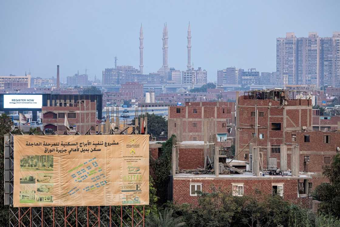 With its green fields, red-brick buildings, irrigation canals and livestock farming, Warraq is a ferry ride away from Cairo's traffic-choked streets With its green fields, red-brick buildings, irrigation canals and livestock farming, Warraq is a ferry ride away from Cairo's traffic-choked streets